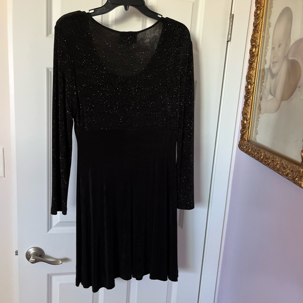 Perfect party dress. Black with sparkles top. Swings with you.worn once. Size 10